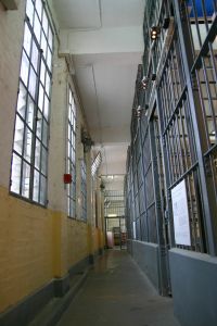 criminal%20jail%20hallway%20with%20white%20and%20yellow%20walls.jpg