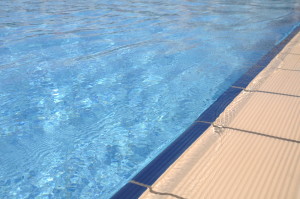 blue and vibrant swimming pool side